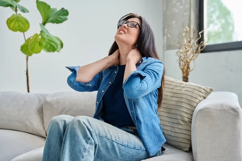 Patient describing tension headache symptoms during exam at ProActive Chiropractic Tampa FL